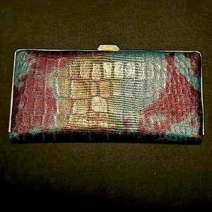 Slim silver tone multi color soft wallet. Pre-loved condition.